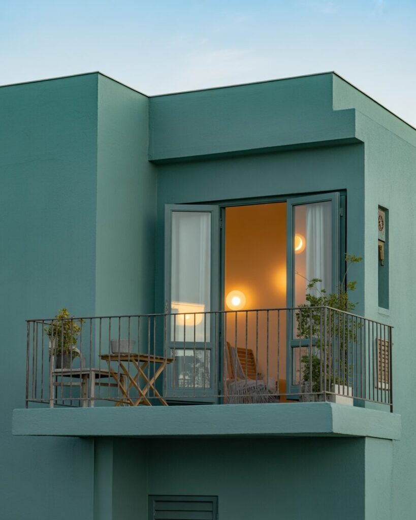 Teal walls in boho-inspired balcony.